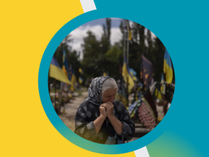 Older woman grieving in a cemetery