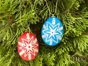 snowflake themed pysanka on a tree